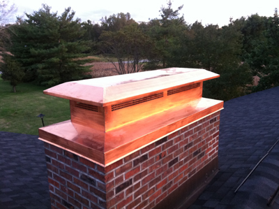 Before and after chimney cap replacement in North Bellmore, NY