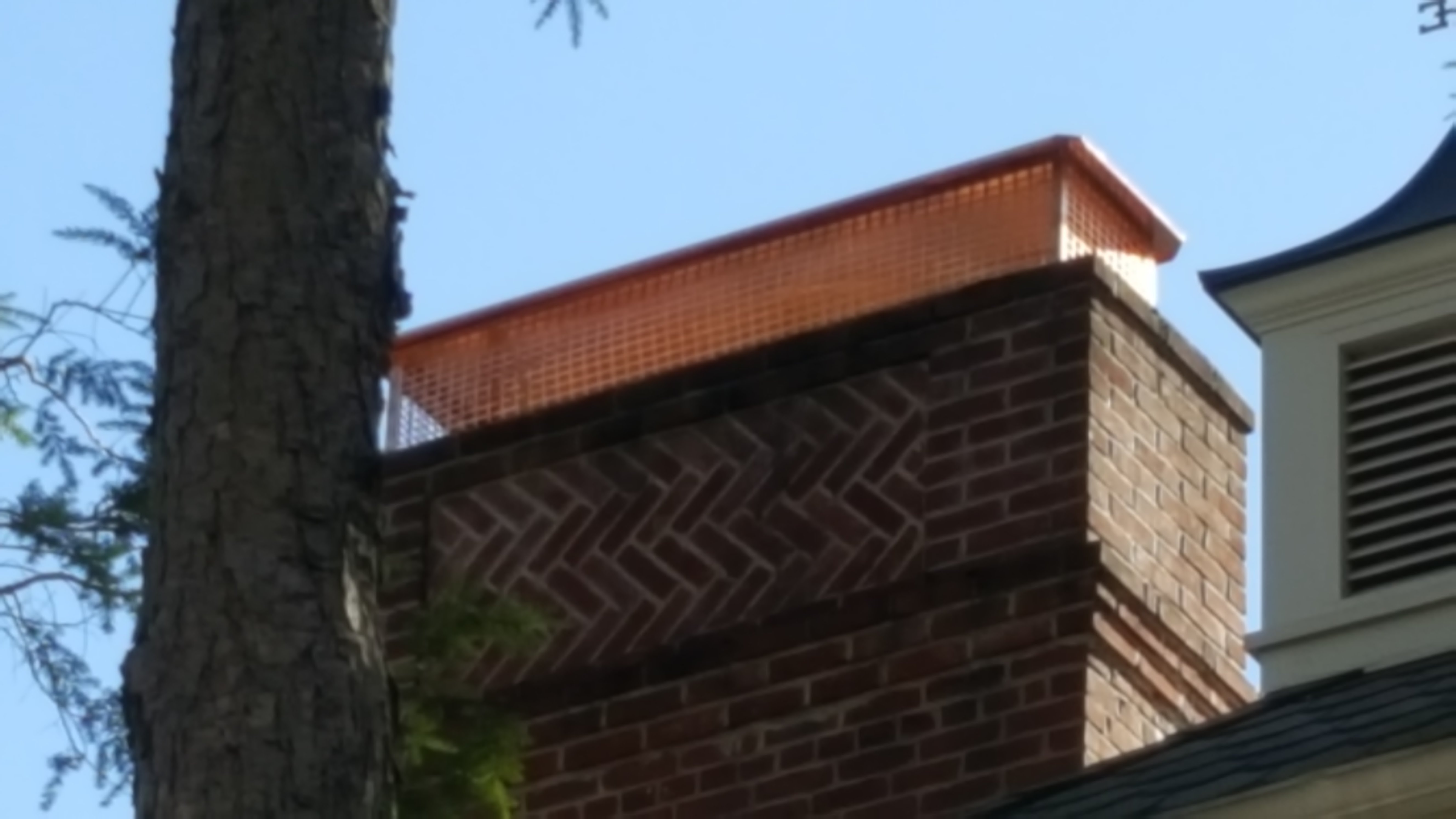 New stainless steel chimney cap installed in North Bellmore, NY