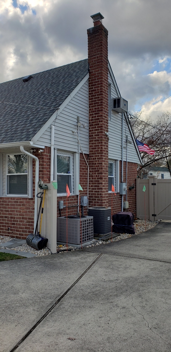 Professional chimney repointing restoring brick joints in North Bellmore, NY